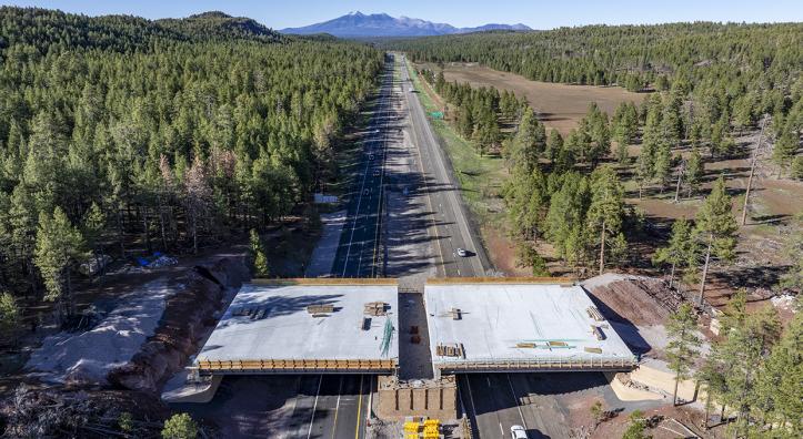 This photograph, made with a drone, shows a new wildlife bridge under construction over Interstate 17 between Munds Park and Flagstaff. | LAURENCE PARENT