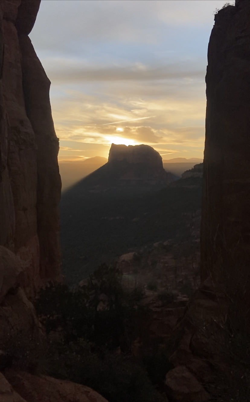 Photo by Lori Napoli   |  A hint of golden light at dawn with shadows of Red Rock Formation 