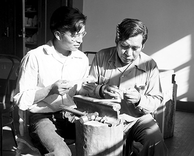Paul Saufkie (right) demonstrates a technique to one of the guild’s students.