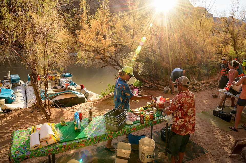 Keeping rafters fed is one of the most vital components of Canyon river guiding. Here, a crew breaks down the kitchen after breakfast at a campsite downstream from Deer Creek. Photograph by Dawn Kish.