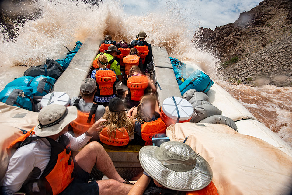 A motor raft navigates a big rapid — one of many Canyon experiences that give rafters an appreciation for the natural world. Photograph by Dawn Kish.