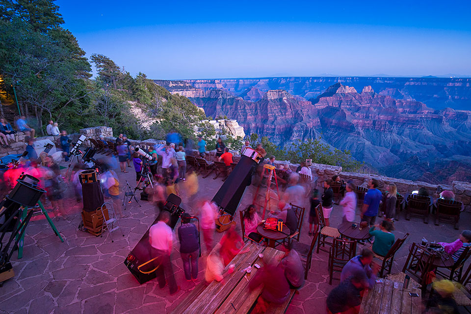 High-powered telescopes line Grand Canyon Lodge’s deck during the Grand Canyon Star Party. The North Rim hosts daytime and nighttime observing during the event. Photograph by John Burcham.