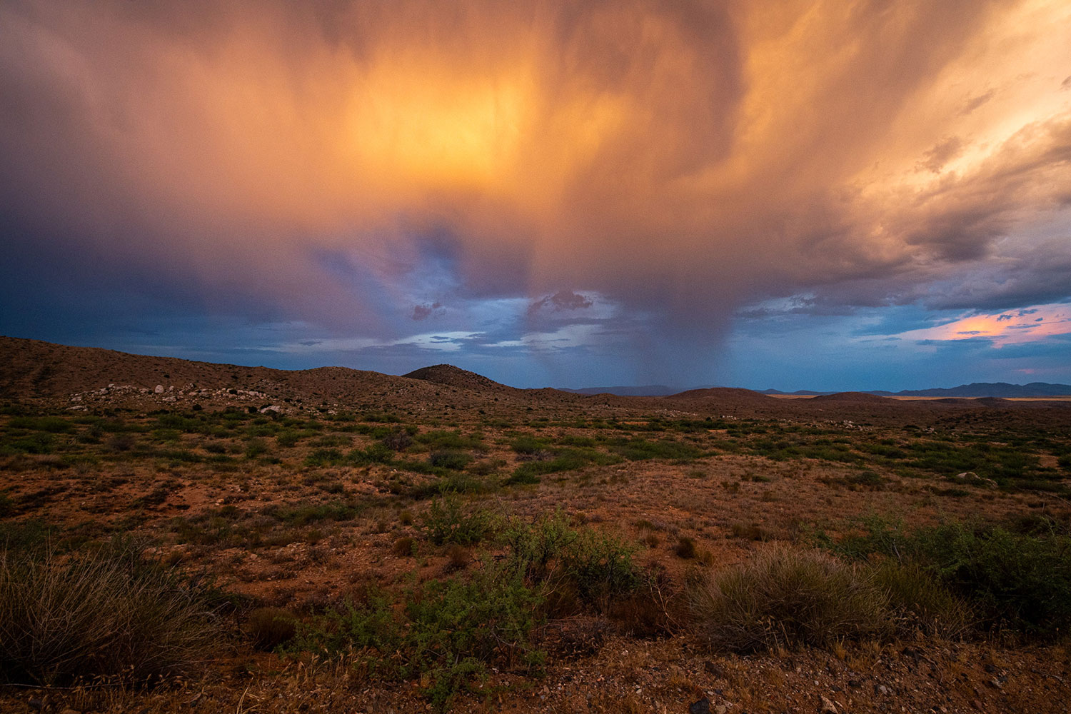 A thunderstorm turns to virga at sunset in Agua Fria National Monument, north of Phoenix. By John Fink