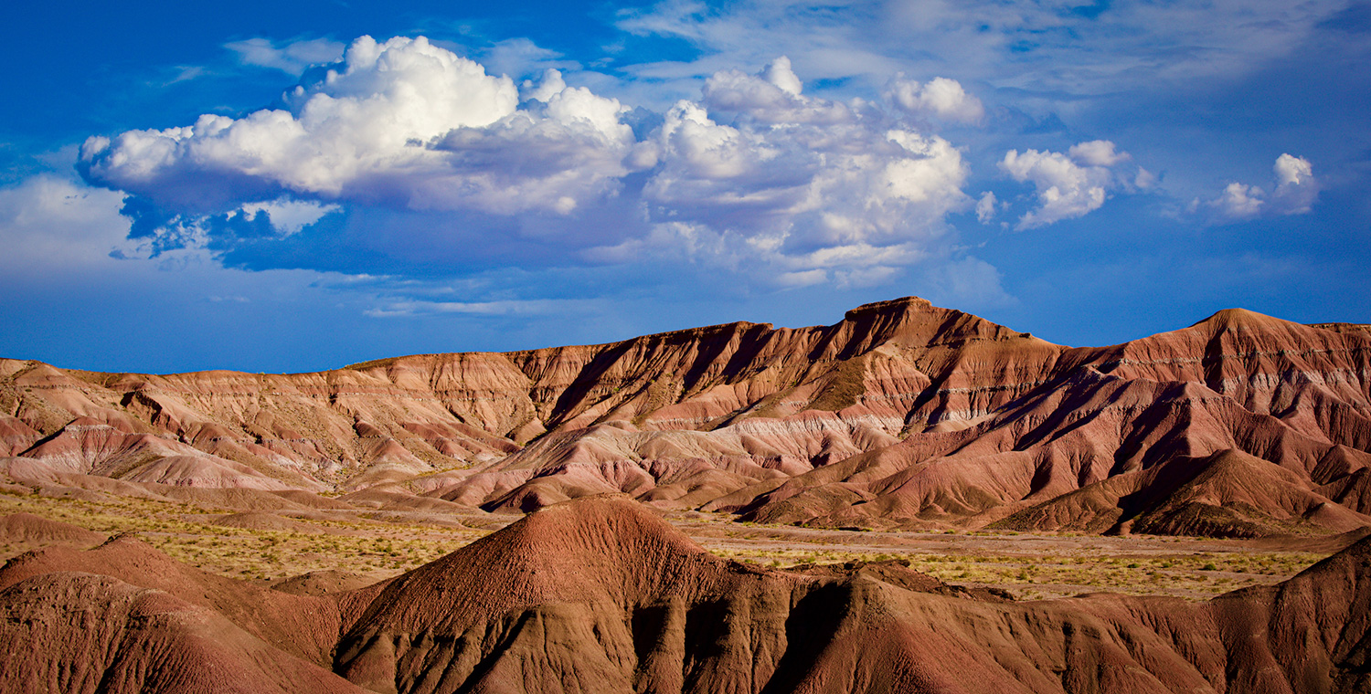 Layered mountains display their colors along U.S. Route 160 in Northeastern Arizona. By Scott Wyne