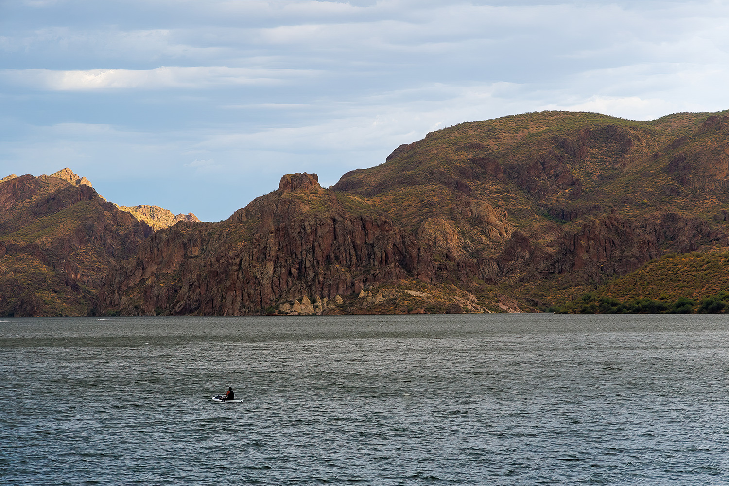 A man navigates his canoe across Saguaro Lake, one of several Salt River reservoirs. By Jonathon Isola