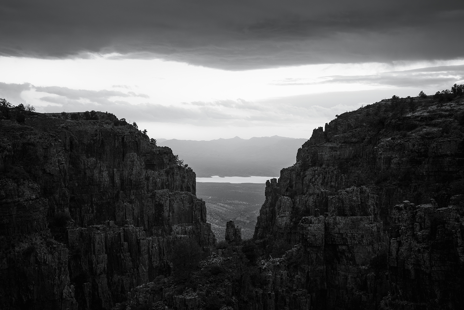 Black and White Wednesday: The rugged cliffs of Parker Creek Canyon tower over the Tonto Basin. By Eric Mischke