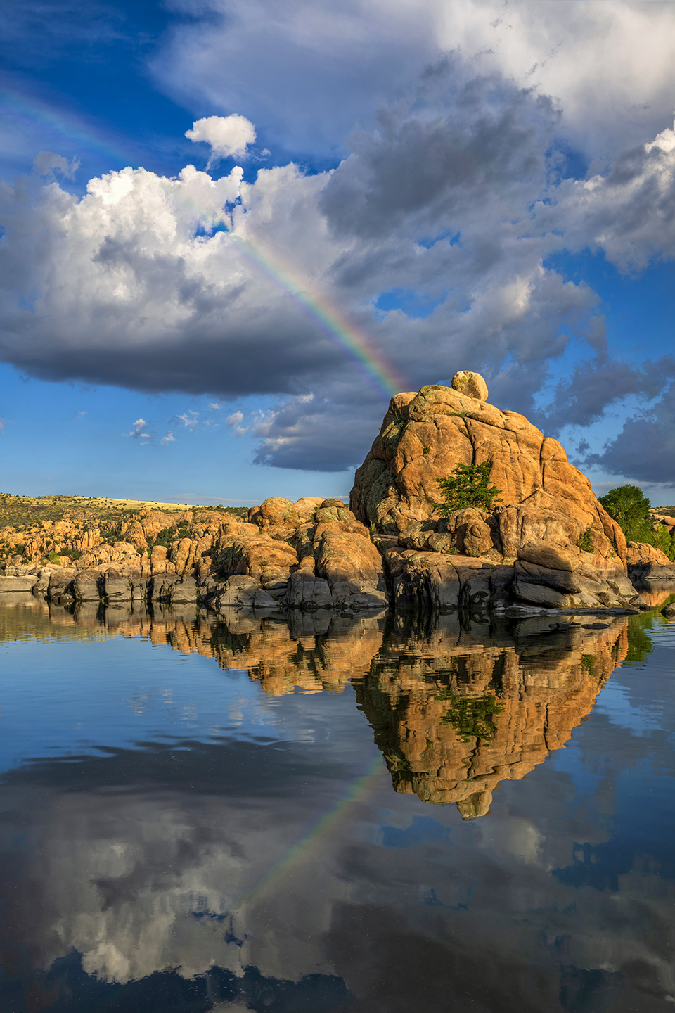 A rainbow appears to erupt from one of the ancient boulder formations at the Granite Dells, which cradle the Prescott area’s Watson Lake. The coarse-grained granite that makes up the Granite Dells is about 1.4 billion years old. | Theresa Rose Ditson