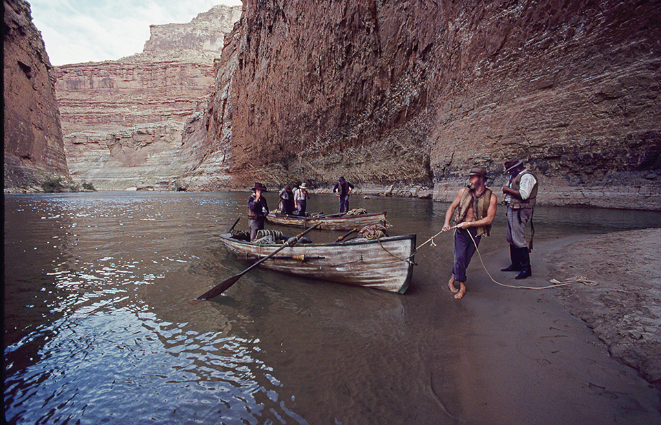 River runners pull two dories ashore at Redwall Cavern in Marble Canyon. The boat in the foreground is 16 feet long, while the one in the background is 21 feet long. Author Brad Dimock captained the 21-foot boat through the Grand Canyon for a 1999 documentary.
