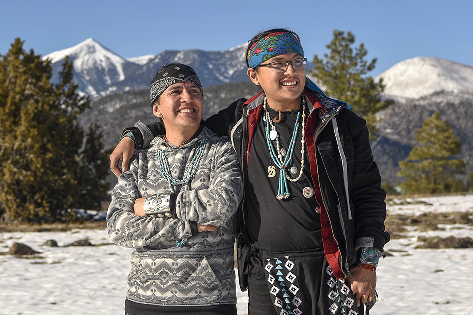 Darrell Marks (left) and his son Makaius, shown in front of the Peaks, have played key roles in the effort to rename Agassiz Peak as Oomàwki, a Hopi word meaning “home of the clouds.” | Chloe Legay/The Lumberjack