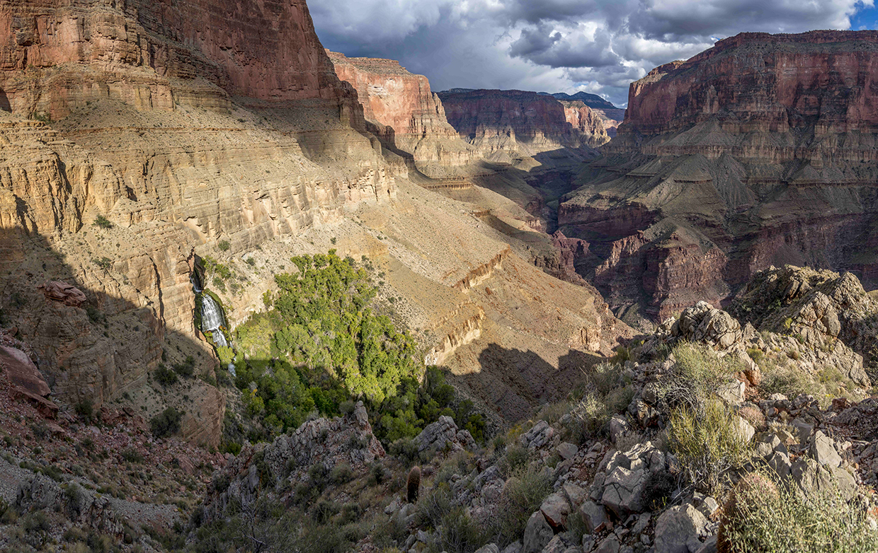 Thunder River Falls pours from an opening in a steep cliff in the Grand Canyon. From here, the Thunder River — referred to in this story as Thunder Creek — flows for only half a mile to its intersection with Tapeats Creek, making it one of the world’s shortest rivers. By Rich Rudow