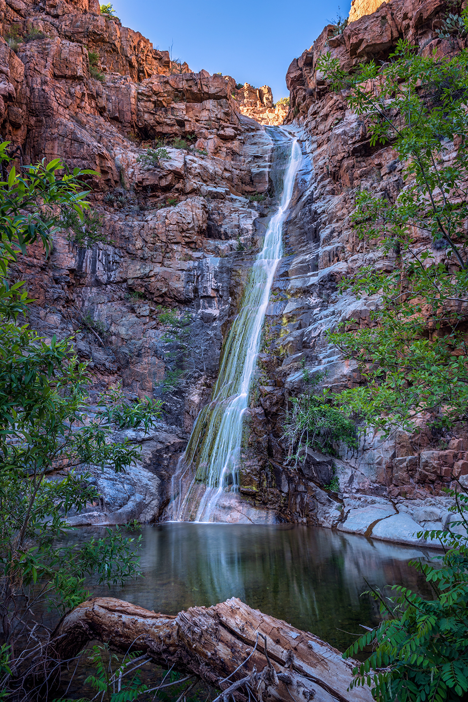 Spring snowmelt fuels an ephemeral waterfall in Gaddes Canyon, south of Jerome, in late-afternoon light. This canyon is on the east side of Mingus Mountain, one of the highest points in the Black Hills. By Theresa Rose Ditson
