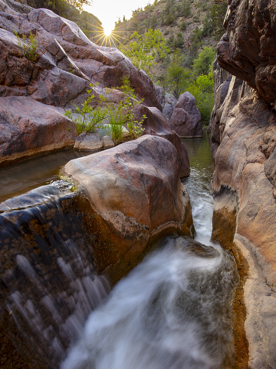 Late-afternoon sun punctuates a view of a slick-rock cascade in a narrow section of Haigler Creek, part of Central Arizona’s Hellsgate Wilderness. Six trailheads provide access to this inhospitable wilderness area, which covers more than 37,000 acres and is managed by the U.S. Forest Service. By Joel Hazelton