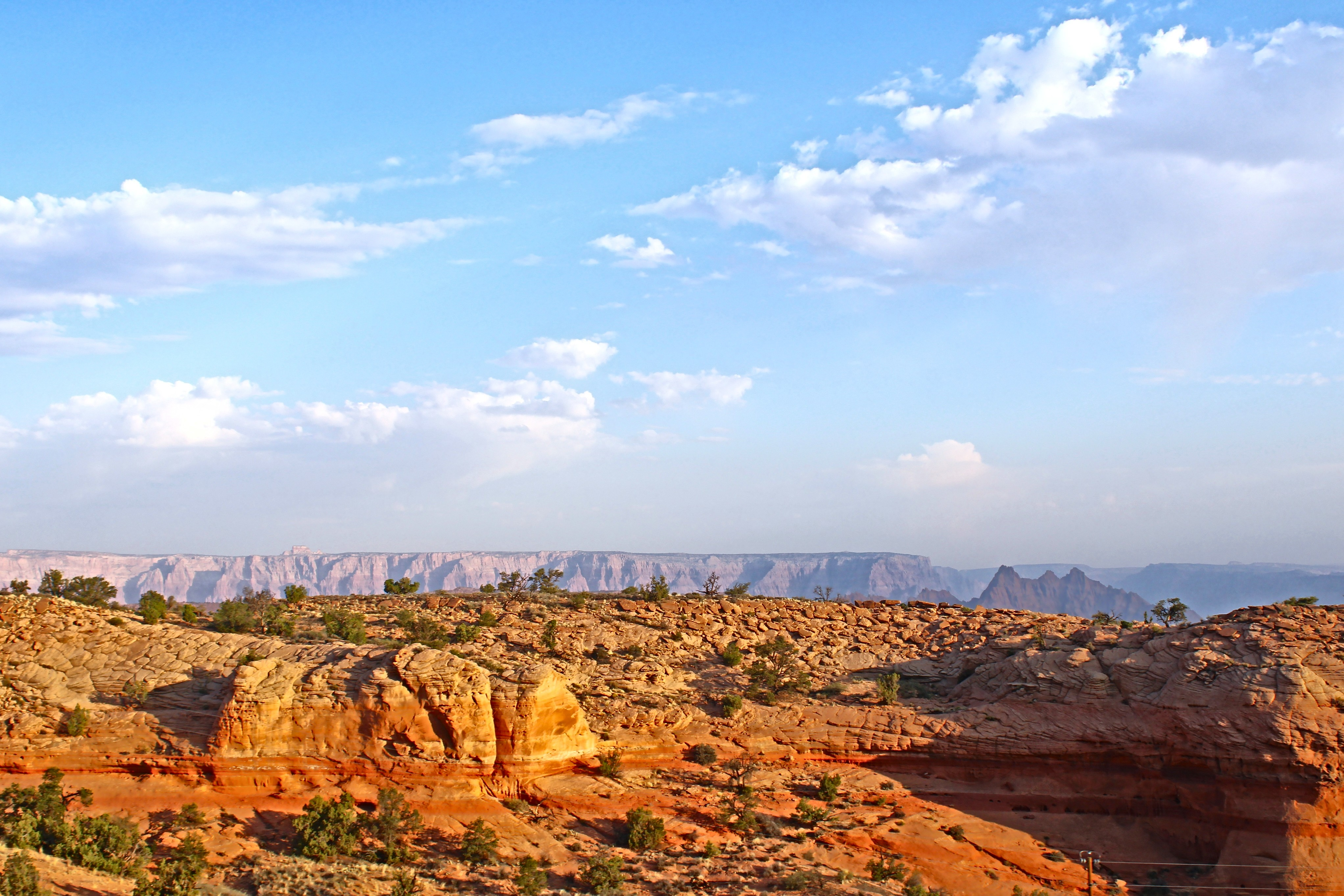 A scenic view of Page, Arizona, affected by smoke from the Dragon Bravo wildfire near Native American Veterans Highway. By Carrie McNamara