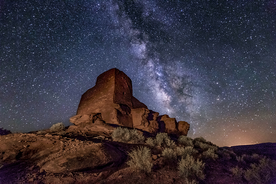 The billions of stars of the Milky Way Galaxy are illuminated above Wukoki Pueblo at Wupatki National Monument, northeast of Flagstaff. By Larry LindaHl