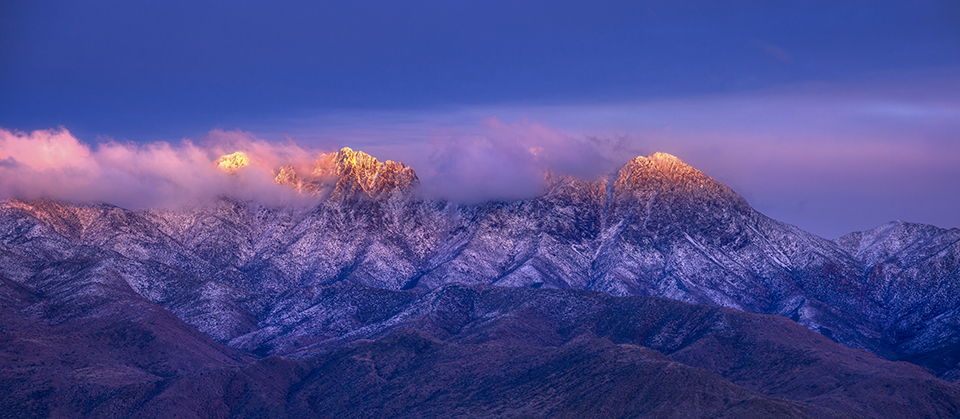 This moody photo of the Four Peaks, northeast of the Phoenix area, captures a fleeting moment as the light disappears from the mountains late in the day. Honorable Mention in the Arizona Highways 17th Annual Photo Contest by Shakil Chowdhury