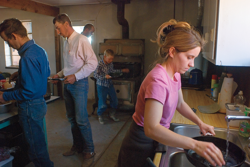 In addition to kitchen duty, Westlake drives heifers onto the loading truck for the Babbitt ranches. By Peter Schwepker
