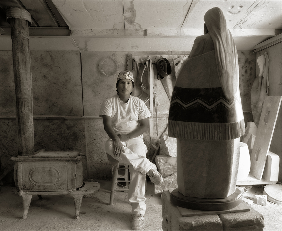 “I had Oreland place one of his beautiful stone creations in the foreground to emphasize his artwork.”