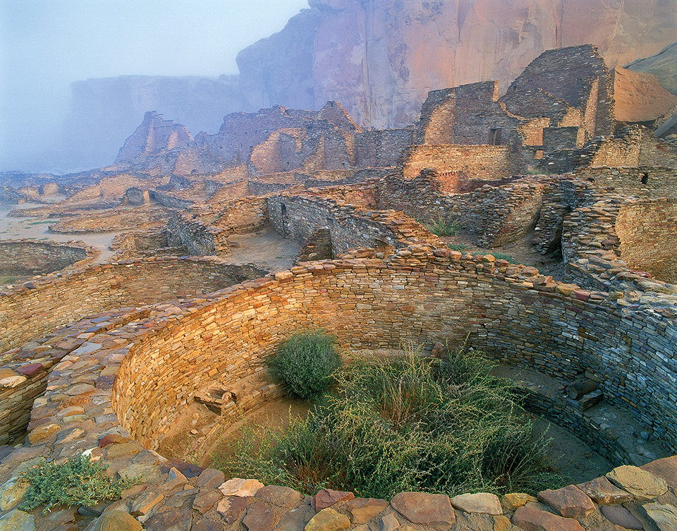 Pueblo Bonito  Morning fog cloaks the ruins at Chaco Canyon. At its zenith, the pueblo rose four or five stories high with more than 800 rooms surrounding a central plaza. A thin layer of protective plaster once covered the tightly packed stone walls.  George H.H. Huey