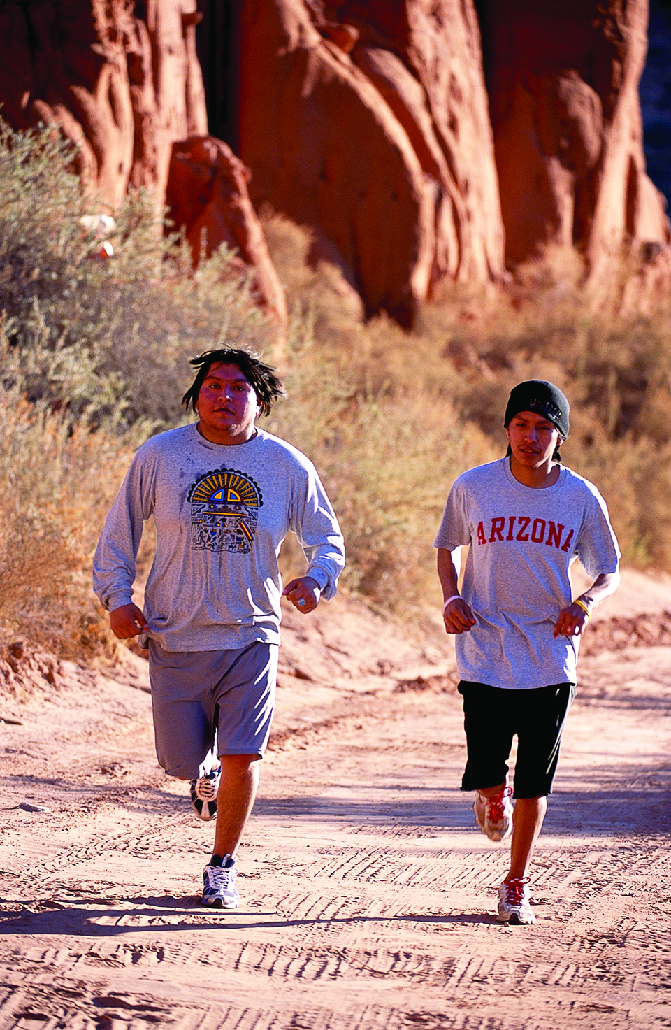 Brothers Ned and John Zeena run through Lower Moenkopi on the Hopi Reservation just west of the Hopi mesas. | Gary Johnson