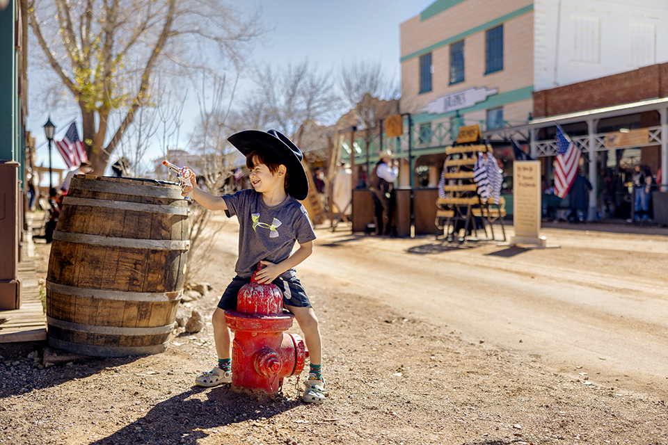 Noel Armenta, 4, of Tucson, plays cowboy on Allen Street. | Jill Richards