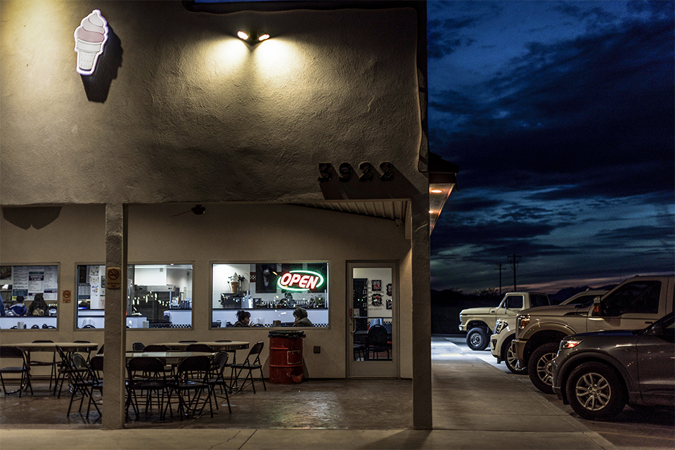Joe’s Ride N Dine in Safford is illuminated against a dusky sky. | Adriana Zehbrauskas