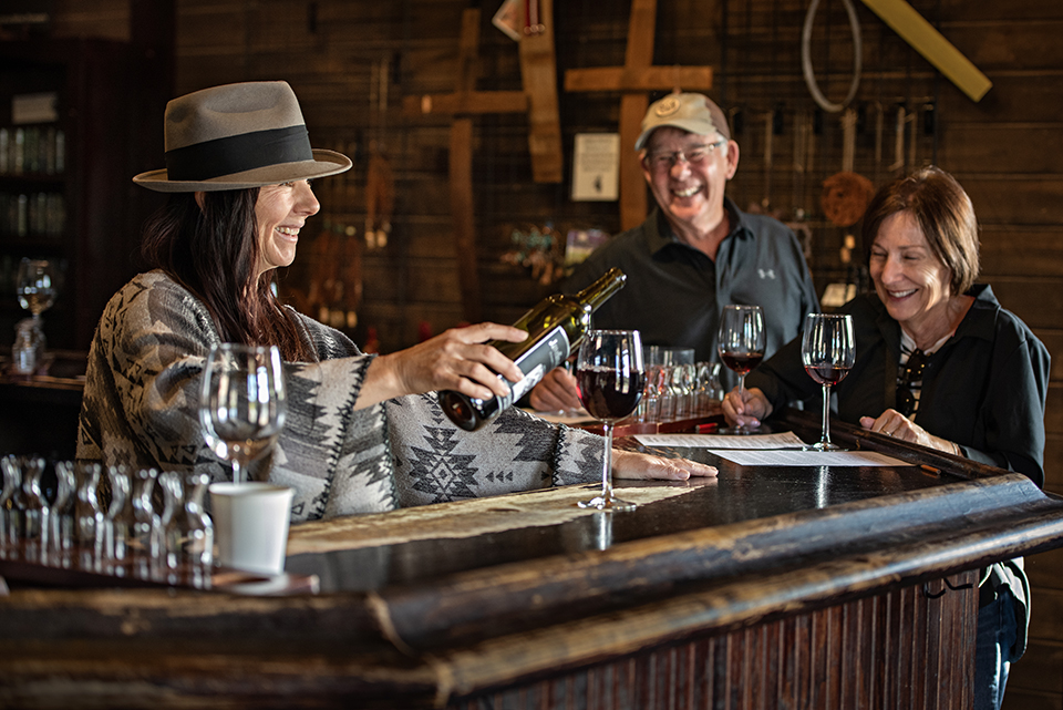 Cornville resident Tania Stoose pours a glass of red wine inside the tasting room at Javelina Leap Vineyard & Winery. | Karen Shell