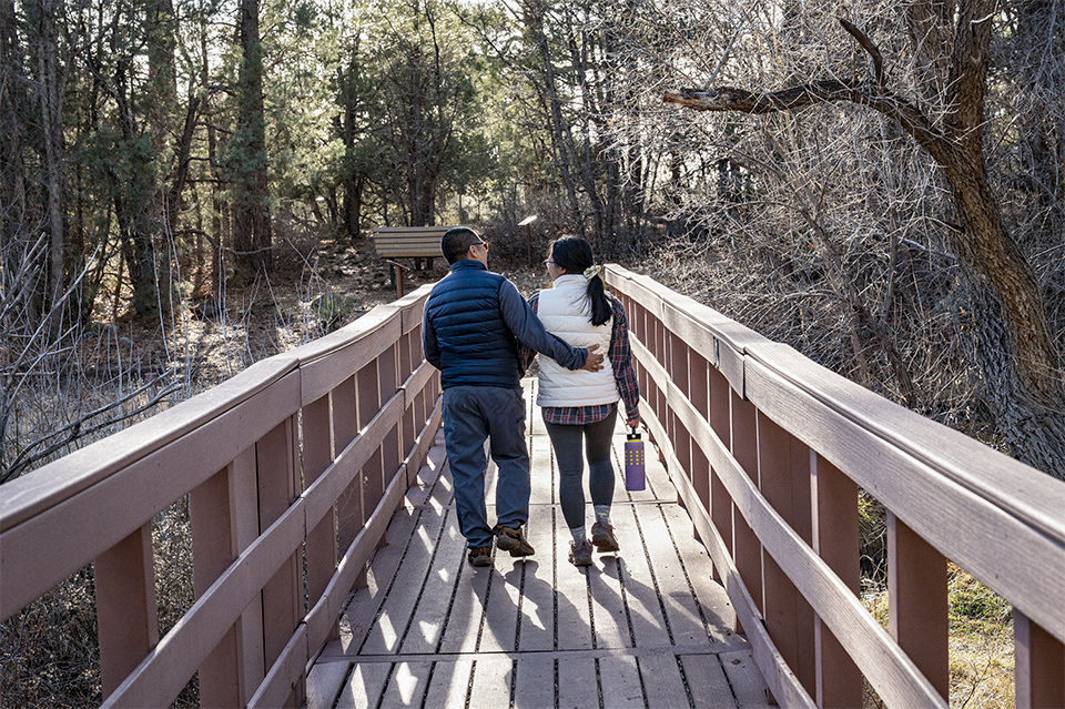 Hikers cross a bridge on the Big Springs Trail, in Pinetop-Lakeside. | Dawn Kish