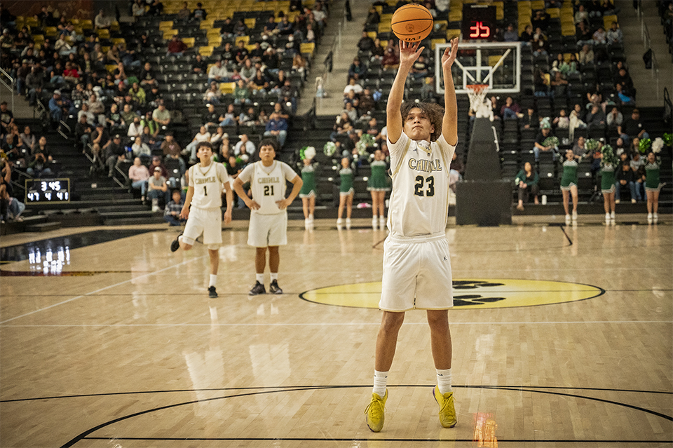 Kollin Laughing of Chinle High School’s basketball team shoots a free throw during a game in February. | Dawn Kish