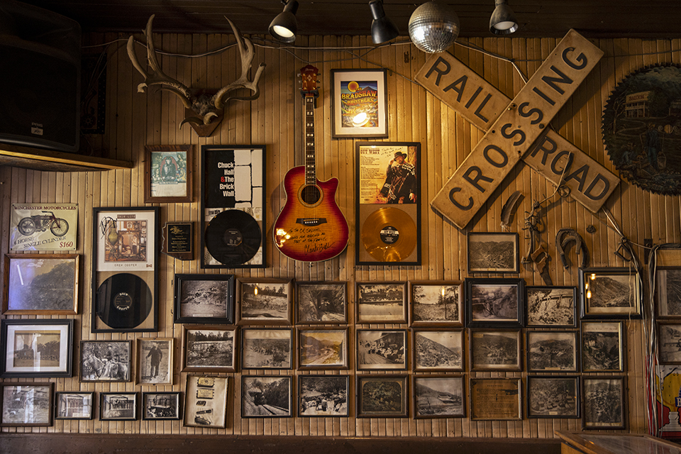 A wall of historic photographs and memorabilia welcomes visitors to the Crown King Saloon and Café. | Mark Lipczynski