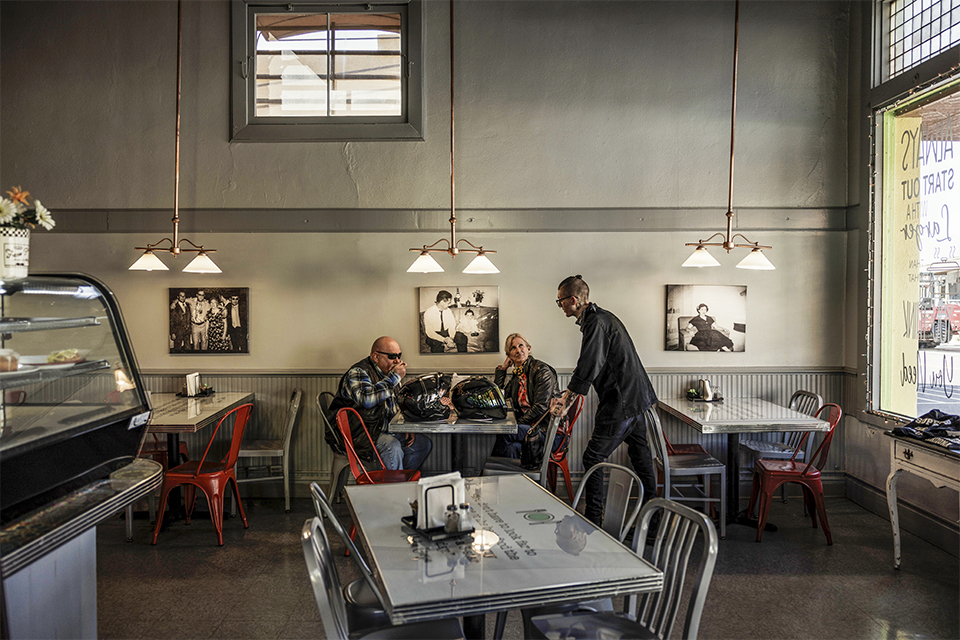 Motorcyclists stop for a reprieve at Bella’s Café, on Main Street, in Superior. | Adriana Zehbrauskas