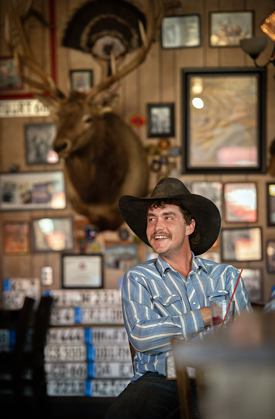 Seligman resident Devon Wingard enjoys a cold beverage at Westside Lilo’s Café. | Karen Shell