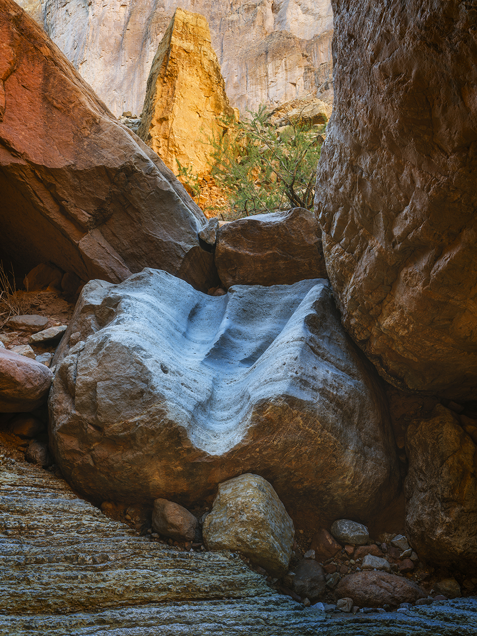 A massive rock pillar glows in reflected light in Little Nankoweap Canyon, a side canyon to the Colorado in the Grand Canyon. | ADAM SCHALLAU