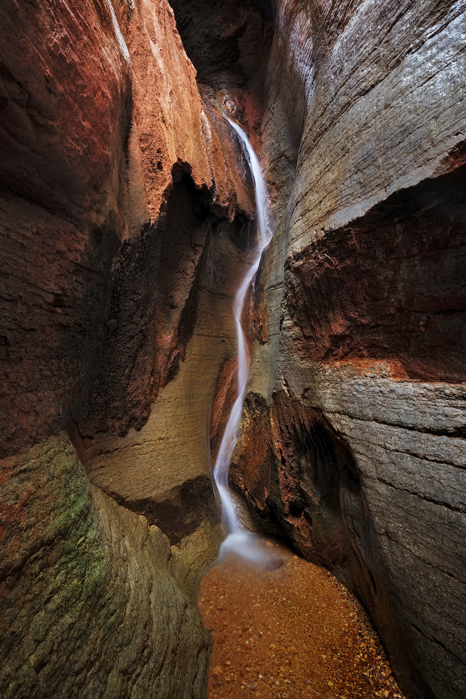 A thin waterfall cascades in Saddle Canyon, near river Mile 47 on the Colorado. | ADAM SCHALLAU