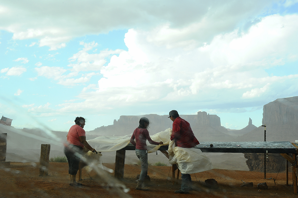 Native artists struggle to protect their work from an oncoming storm in Monument Valley. By Marie Baronnet