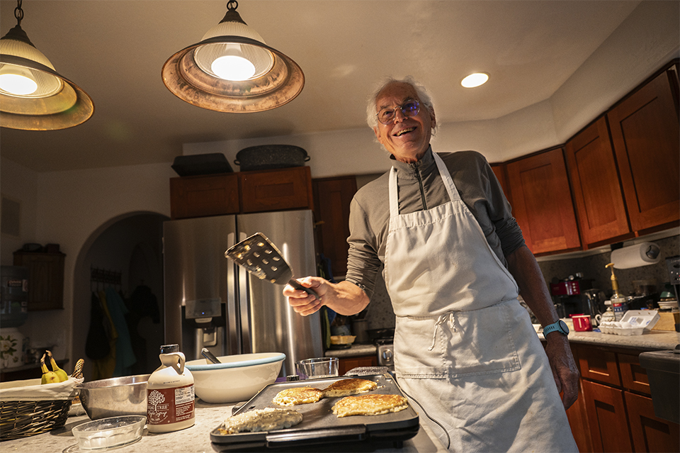 Tim Varner makes pancakes for Keil in his Flagstaff home. Although “angels” aren’t officially affiliated with the Arizona Trail Association, hikers can reach out via a database of volunteers’ phone numbers. | Dawn Kish
