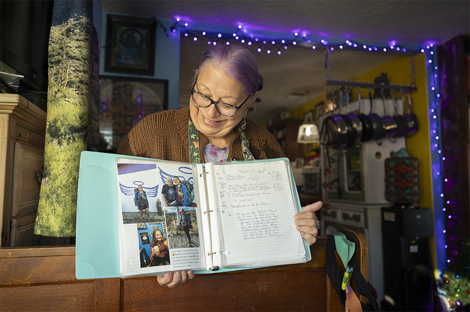 Mary Jo Kvidera, another angel, displays a scrapbook of her experiences with thru-hikers. | Dawn Kish