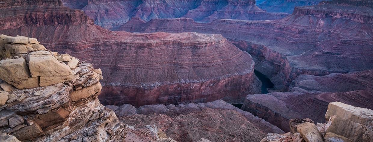 The Colorado River flows through Marble Canyon at sunset in a view from Buck Farm Viewpoint. | Gary Ladd