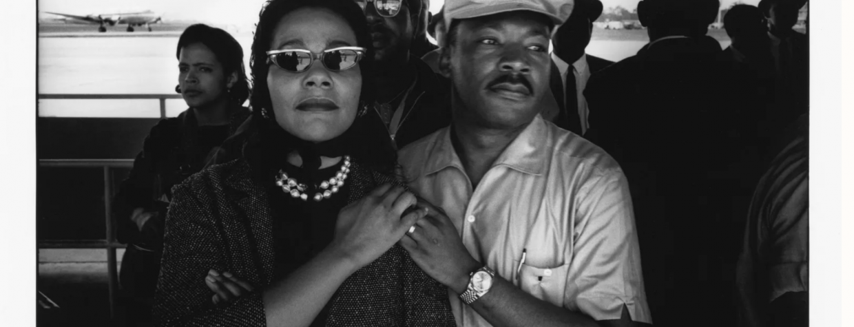 A black and white image depicts Coretta Scott King and Martin Luther King Jr.