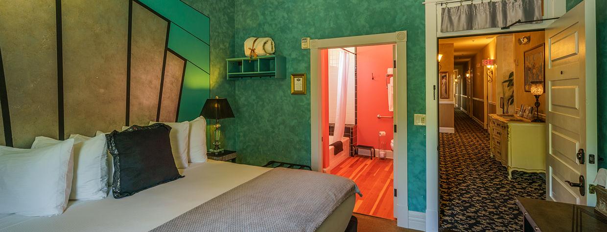 A room at the Grand Highland Hotel with view of bathroom and outside hallway. By Laurence Parent