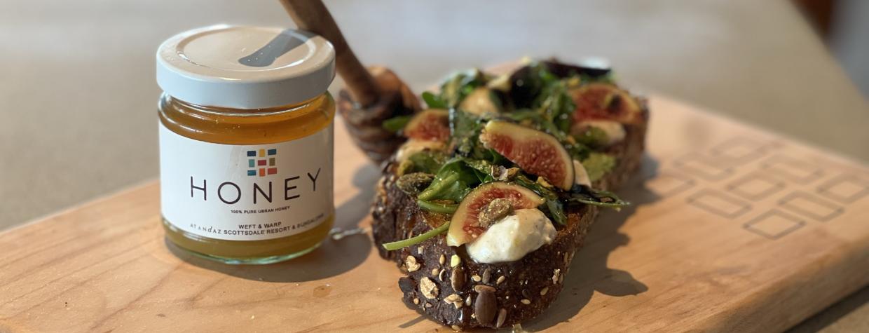 A color image shows a small jar of honey and two bite-sized snacks with fig, honey and cheese.