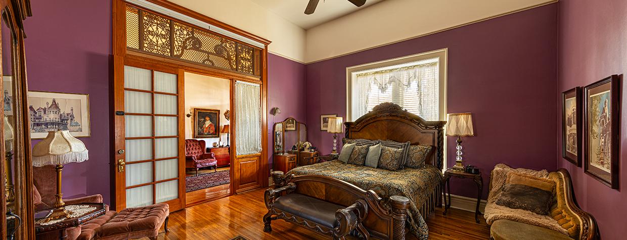 Interior of room at the Blenman Inn features classic Victorian design and modern amenities, such as the pictured ceiling fan. By Steven Meckler