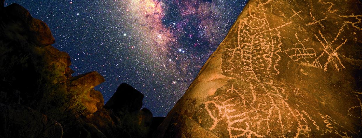 In this composite image, Hohokam rock art is illuminated against a Milky Way backdrop in Southern Arizona’s Picacho Mountains. The long swath of dots may symbolize the universe, along with other sky objects and serpents, which are thought to represent prayers being carried to the gods. | Frank Zullo
