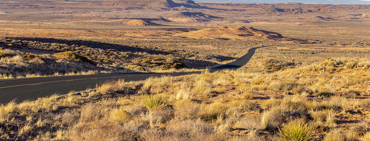 The Tse’nikani Scenic Road, a stretch of U.S. Route 191, curves through the expansive landscape of the Navajo Nation. By John Burcham