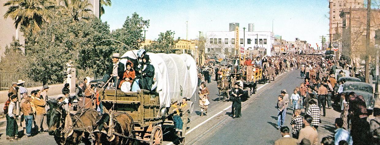 Tucson residents line one of the city’s streets during a Tucson Rodeo parade in the 1950s. | Arizona Highways Archives