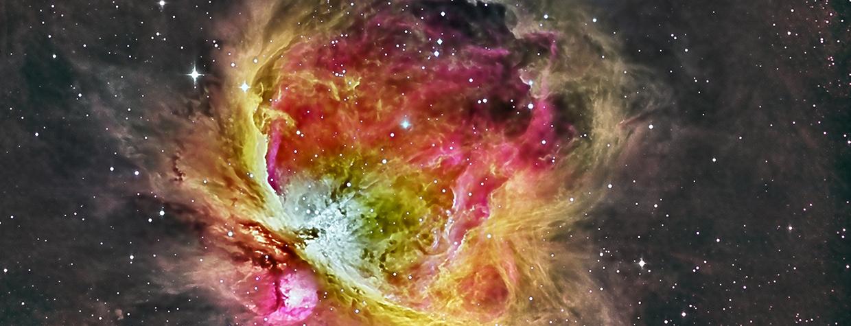 Red and yellow hues feature prominently in this colorful deep space photograph by Ken Naiff.