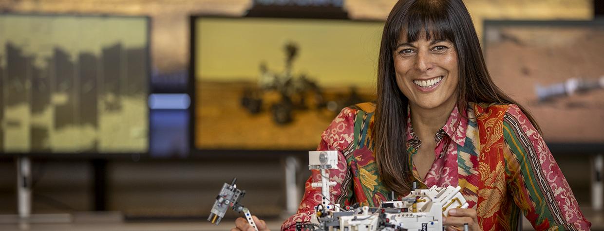 Meenakshi Wadhwa poses with a small scale model of an extraterrestrial land rover. By Paul Markow