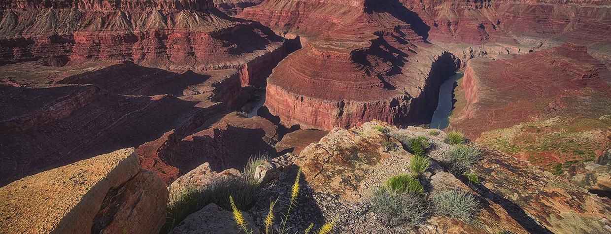 A dramatic view of Horseshoe Bend from the rim or Marble Canyon under cloudy skies. By Shane McDermott