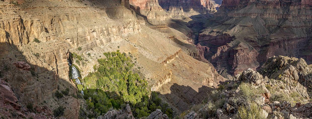 Thunder River Falls pours from an opening in a steep cliff in the Grand Canyon. From here, the Thunder River — referred to in this story as Thunder Creek — flows for only half a mile to its intersection with Tapeats Creek, making it one of the world’s shortest rivers. By Rich Rudow