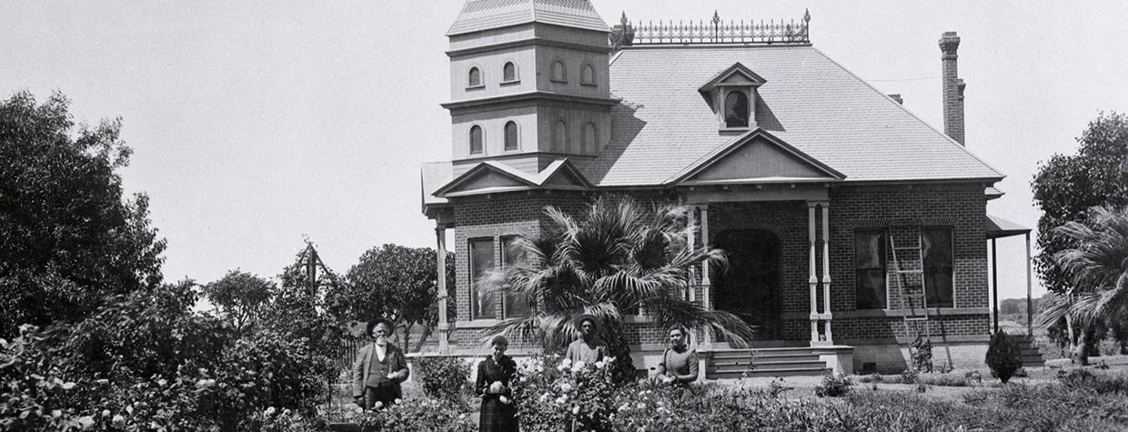 From left, Columbus and Mary Adeline Norris Gray, an unidentified servant and Mary Green are shown outside the Grays’ home in Phoenix. Courtesy Greater Arizona Collection, Arizona State University Library