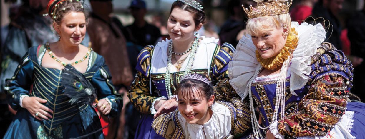 Elaborate medieval costumes are worn by characters at the Arizona Renaissance Festival.